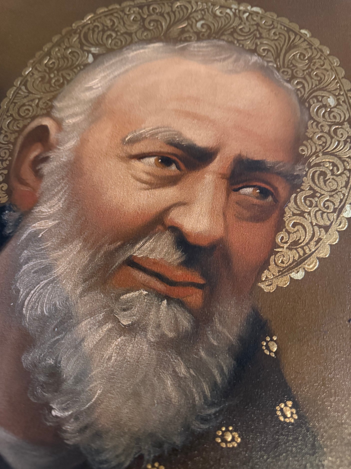 Close-up of Padre Pio face in Peruvian sacred art