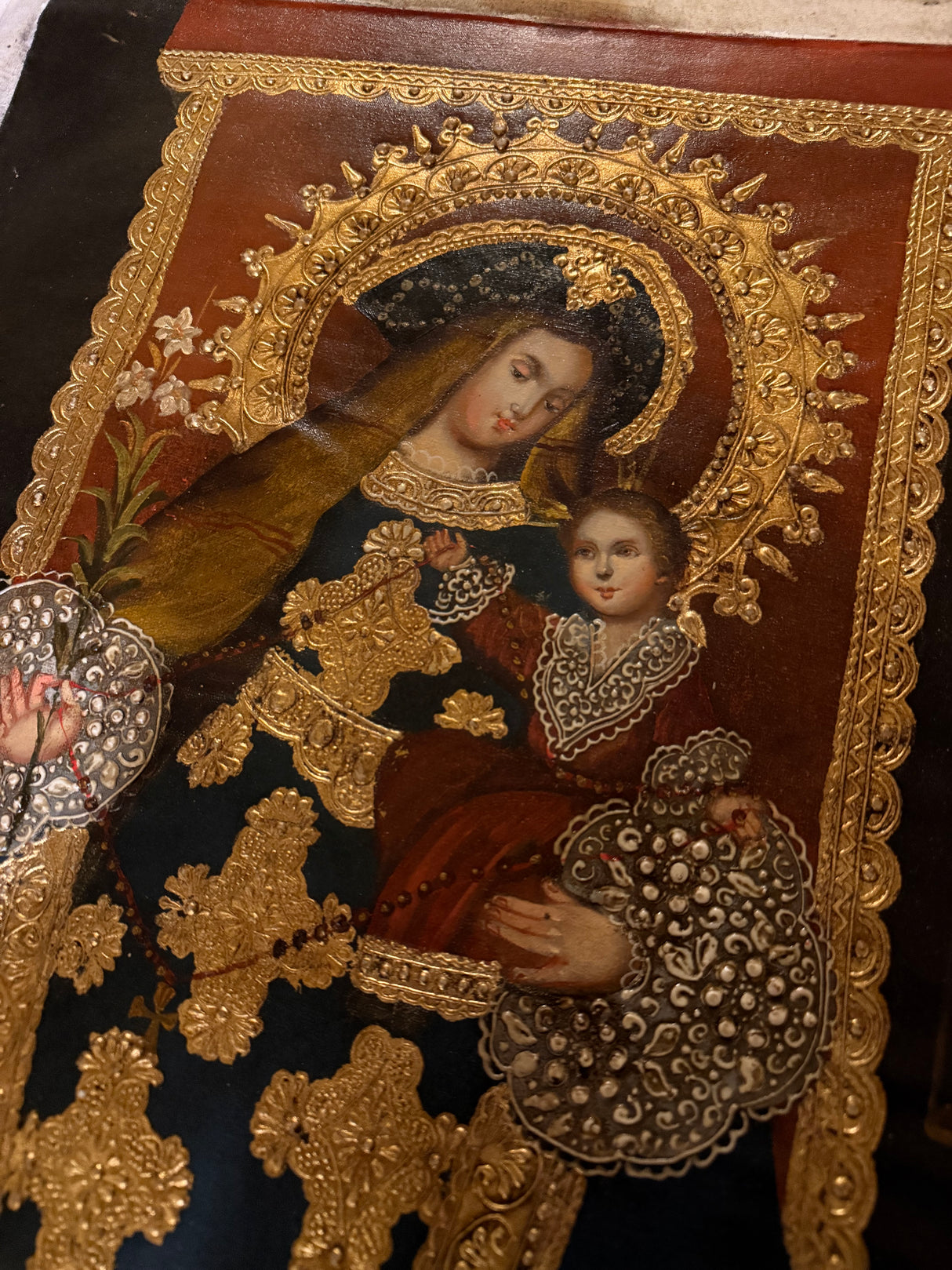 Close-up of Peruvian Virgen del Rosario sacred art