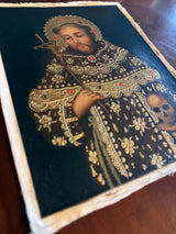 Detail of Saint John of the Cross painting with gold ornamentation